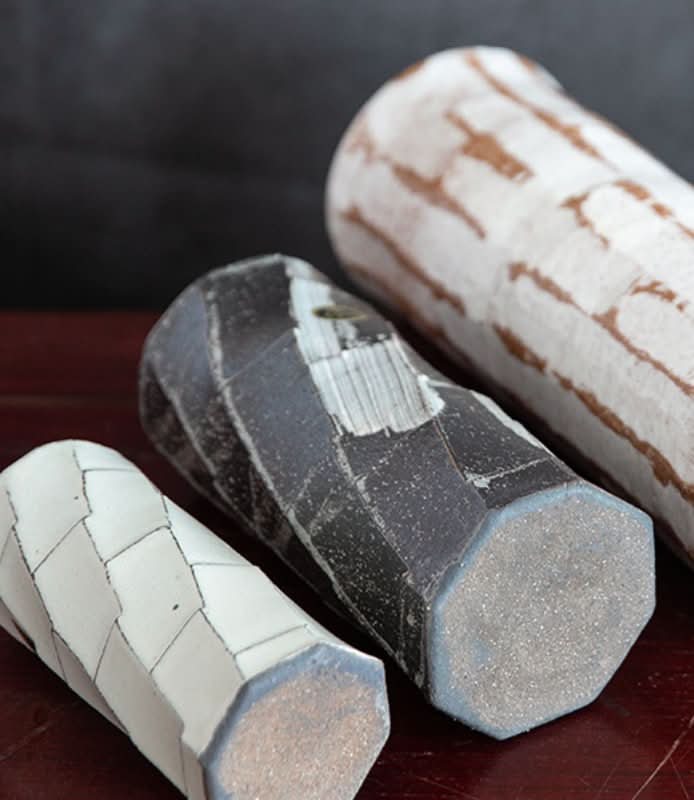 Japan imported Shigaraki ceramic flower arrangements: faceted black and white pottery vases.