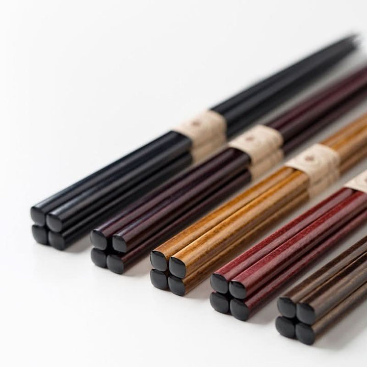 Five pairs of colorful wooden chopsticks, natural wood grain, non-slip design.