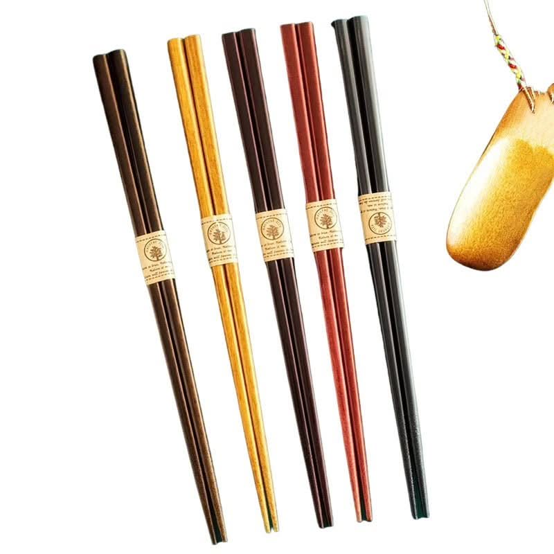 Set of colorful wooden chopsticks, various natural wood tones.