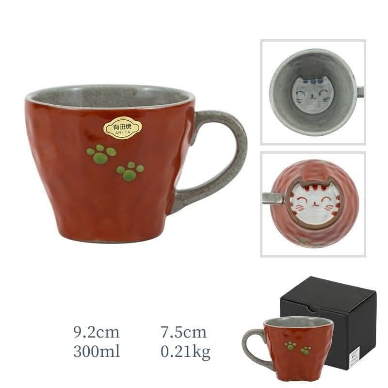 Japan imports Arita ware hand-made cat mug, red with paw prints, grey interior.