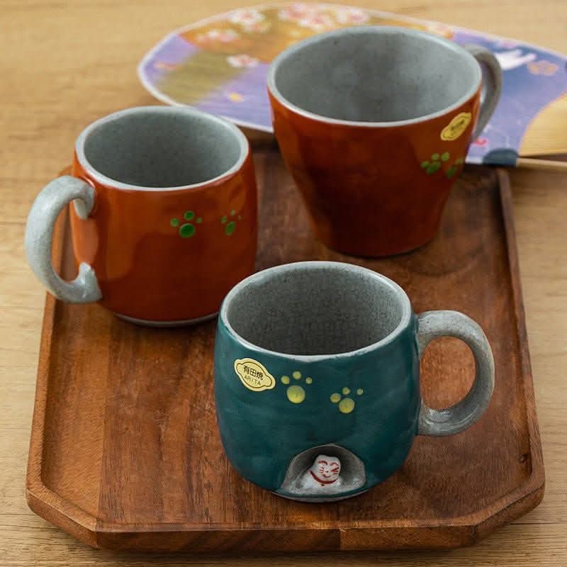 Japan Arita ware hand-made cat mug, teal with cat, paw prints, wooden tray