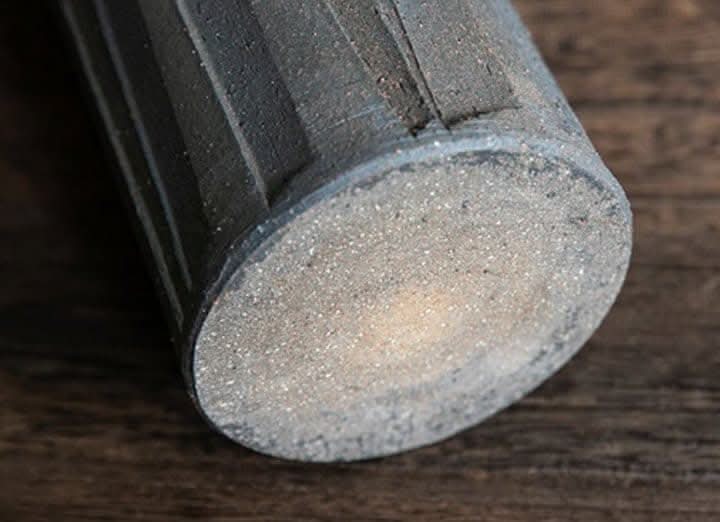 Japan imports lead-colored Shigaraki ceramic rough pottery vase with textured surface.