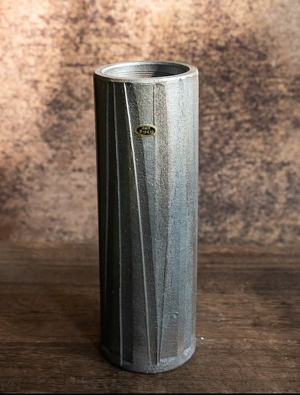 Lead-colored Shigaraki ceramic vase with textured finish on wood background.