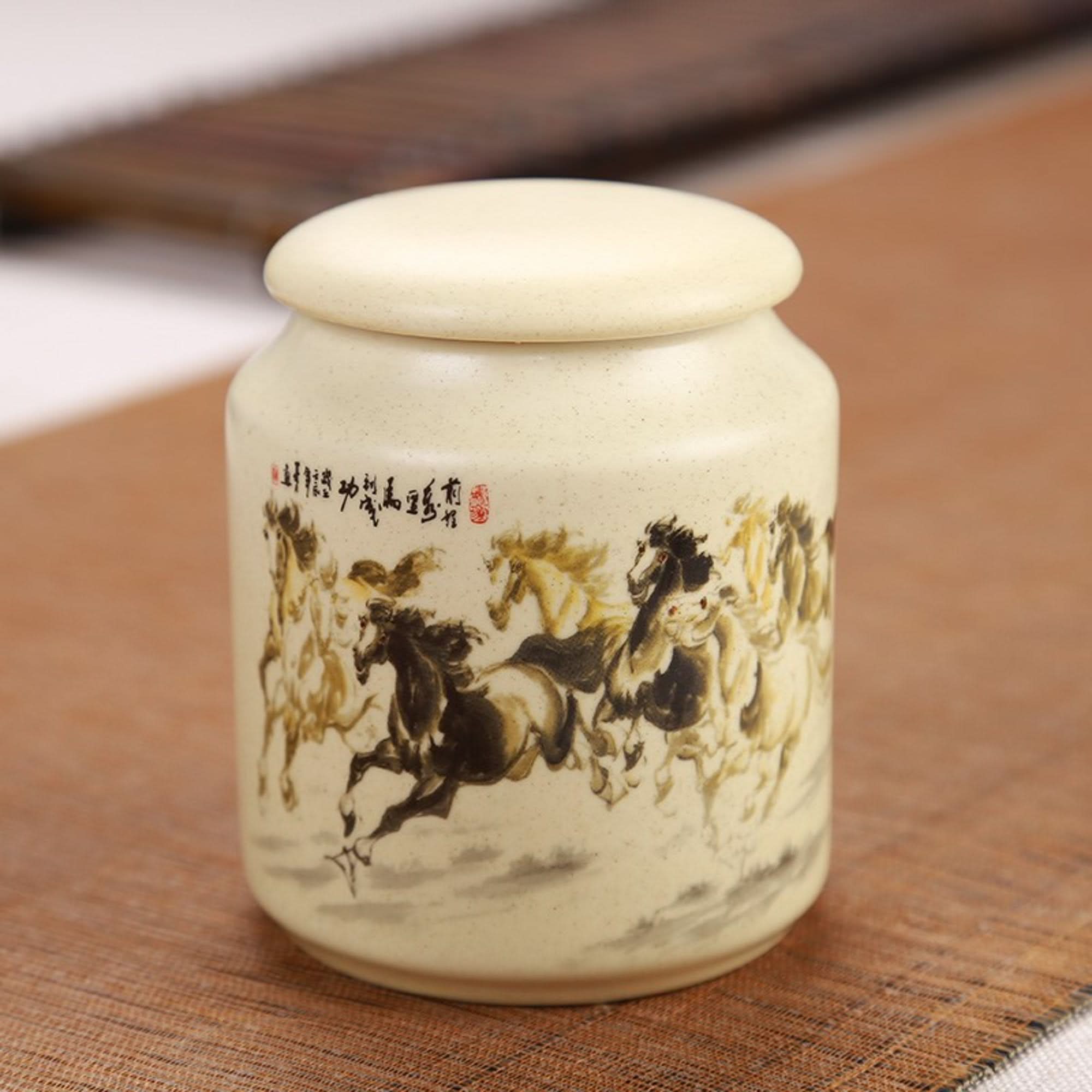 Japanese art ceramic tea container with running horses, light beige, for storage.