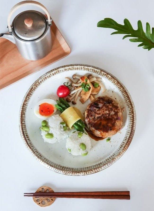 Japanese Tableware Handmade Set with a gourmet meal served on a textured ceramic plate.