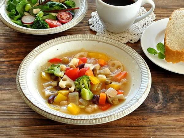 Japanese Tableware Handmade Set: Vegetable soup in textured ceramic bowl, served with salad & bread.