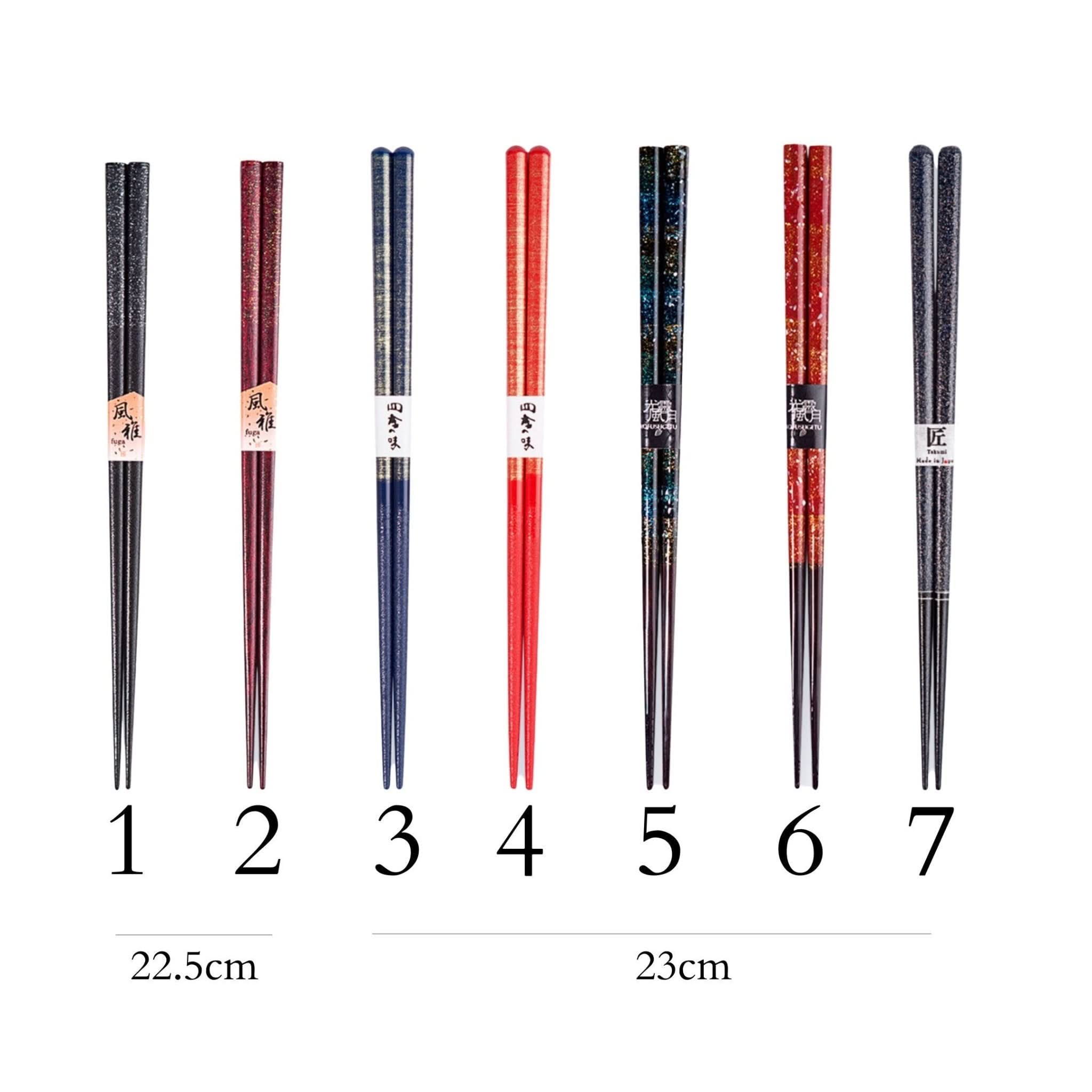 Assortment of Japanese handmade wooden chopsticks in various colors and patterns.