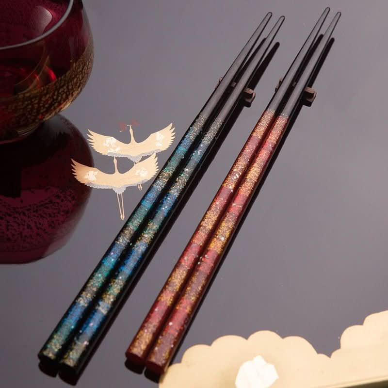 Japanese Handmade Wooden Chopsticks with glittering blue and red designs, featuring cranes.