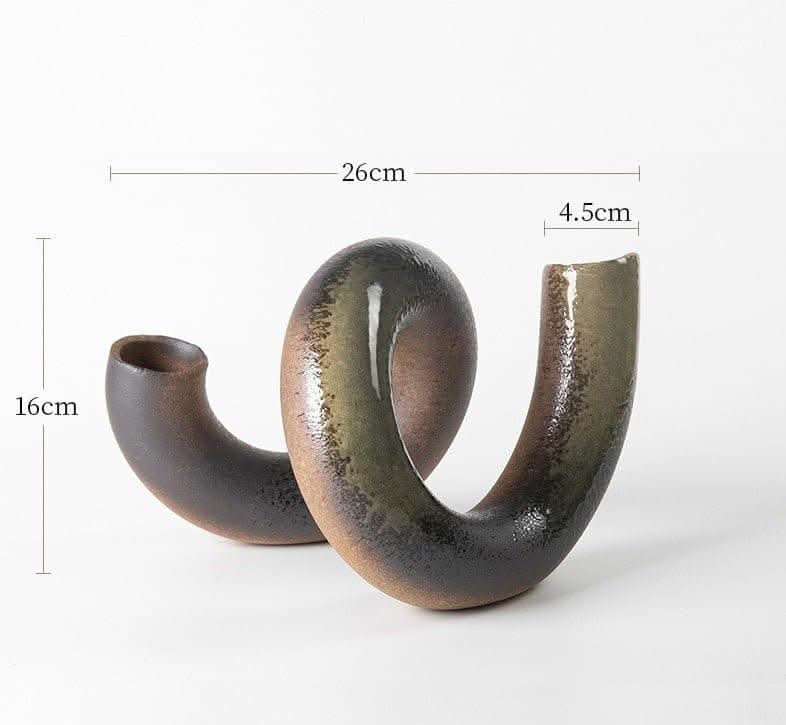 Japanese imported irregular spiral ceramic flower vase with earthy tones.