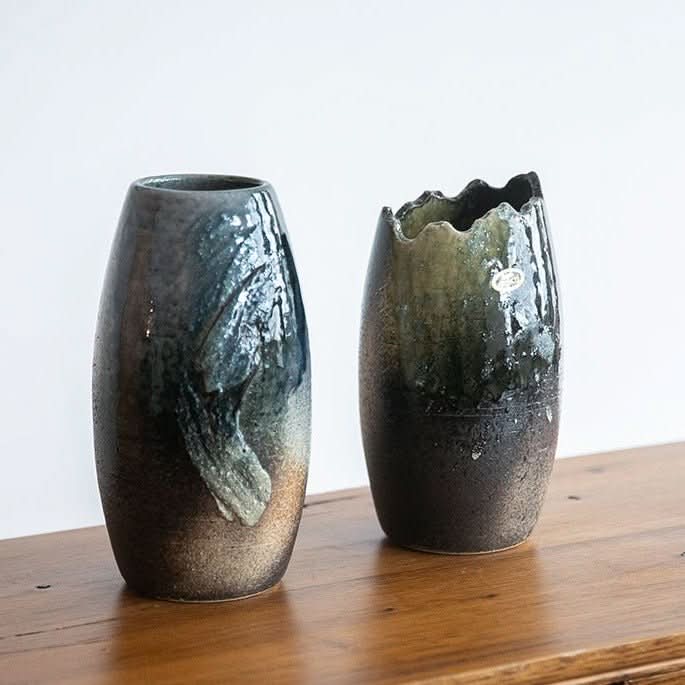 Japanese Kiln Long Handmade Vase with textured finish, deep blues and greens, on wood.