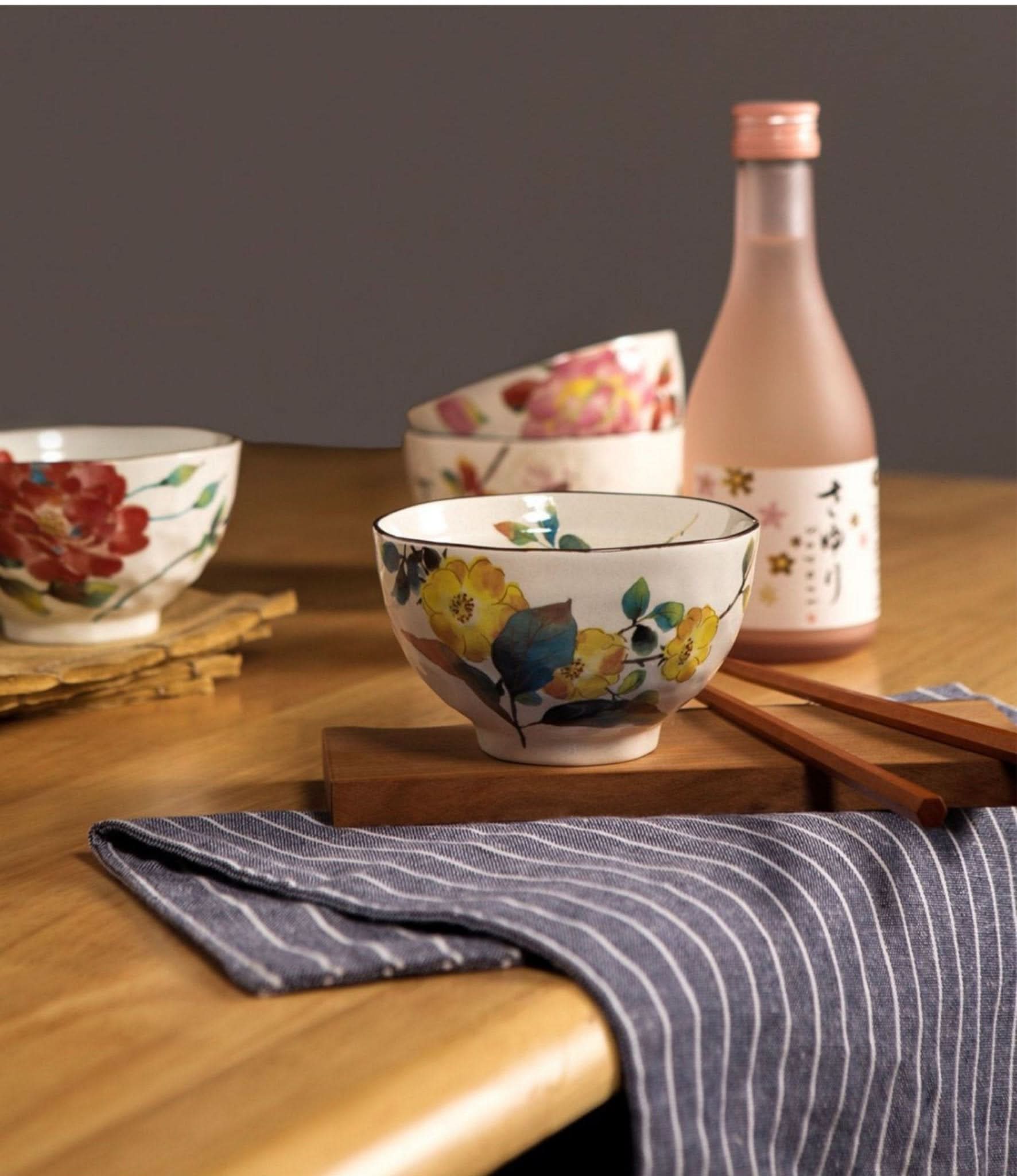 Ceramic Rice Bowl Set Made In Japan with floral patterns on wooden table.