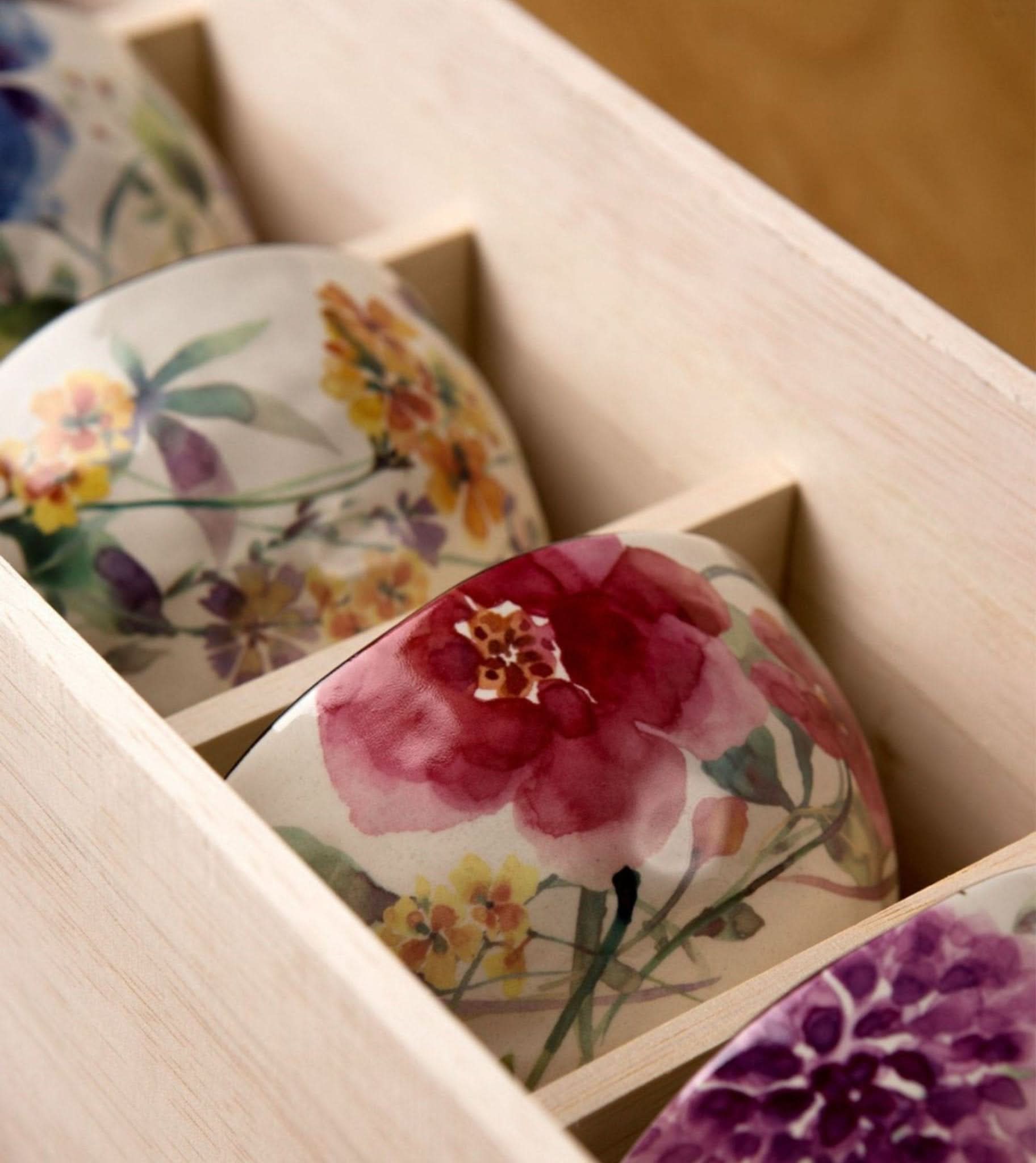 Japanese rice bowl set with floral watercolor designs in a wooden box.