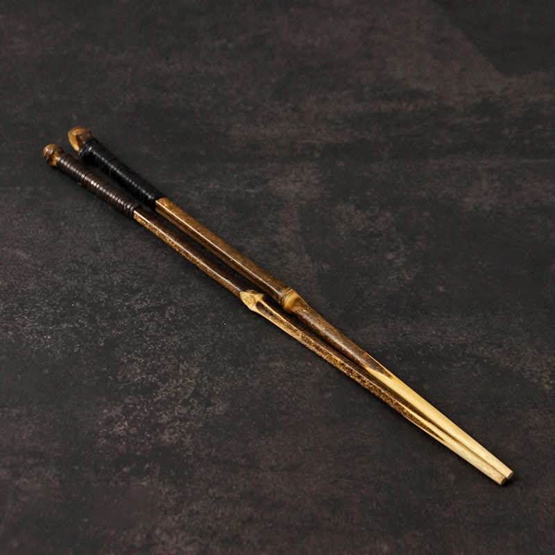 Japanese Style Bamboo Wood Chopsticks | Natural bamboo with dark grips on a textured dark background.