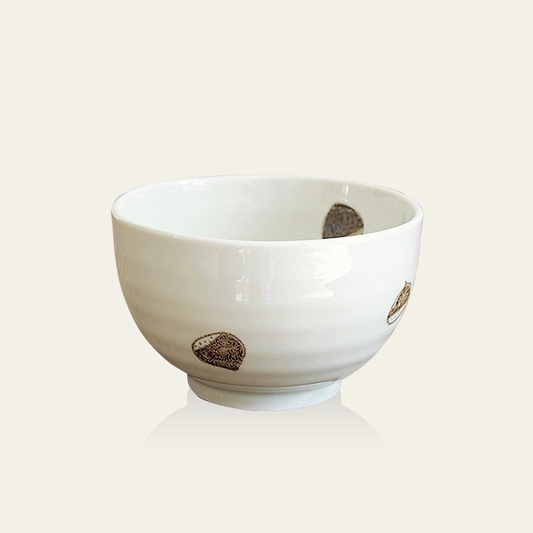 White ceramic Japanese Minoyaki rice bowl with brown speckled pattern.