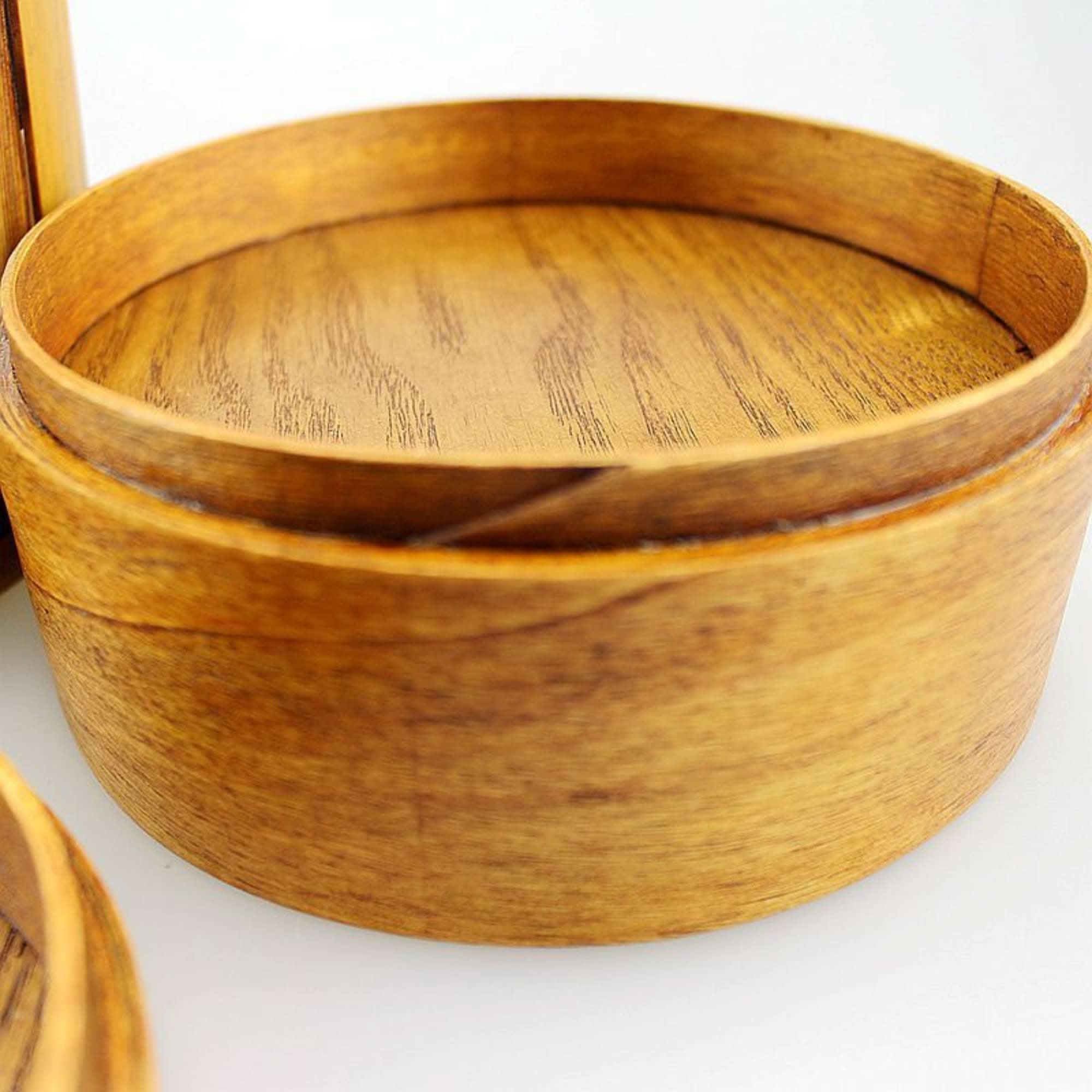 Wooden Japanese lunch box with natural grain texture and warm brown tones.