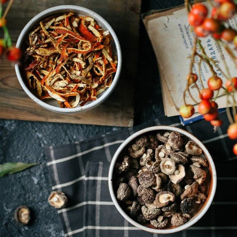 Japanese Style Stoneware Fruit Plate with dried orange peels and mushrooms.