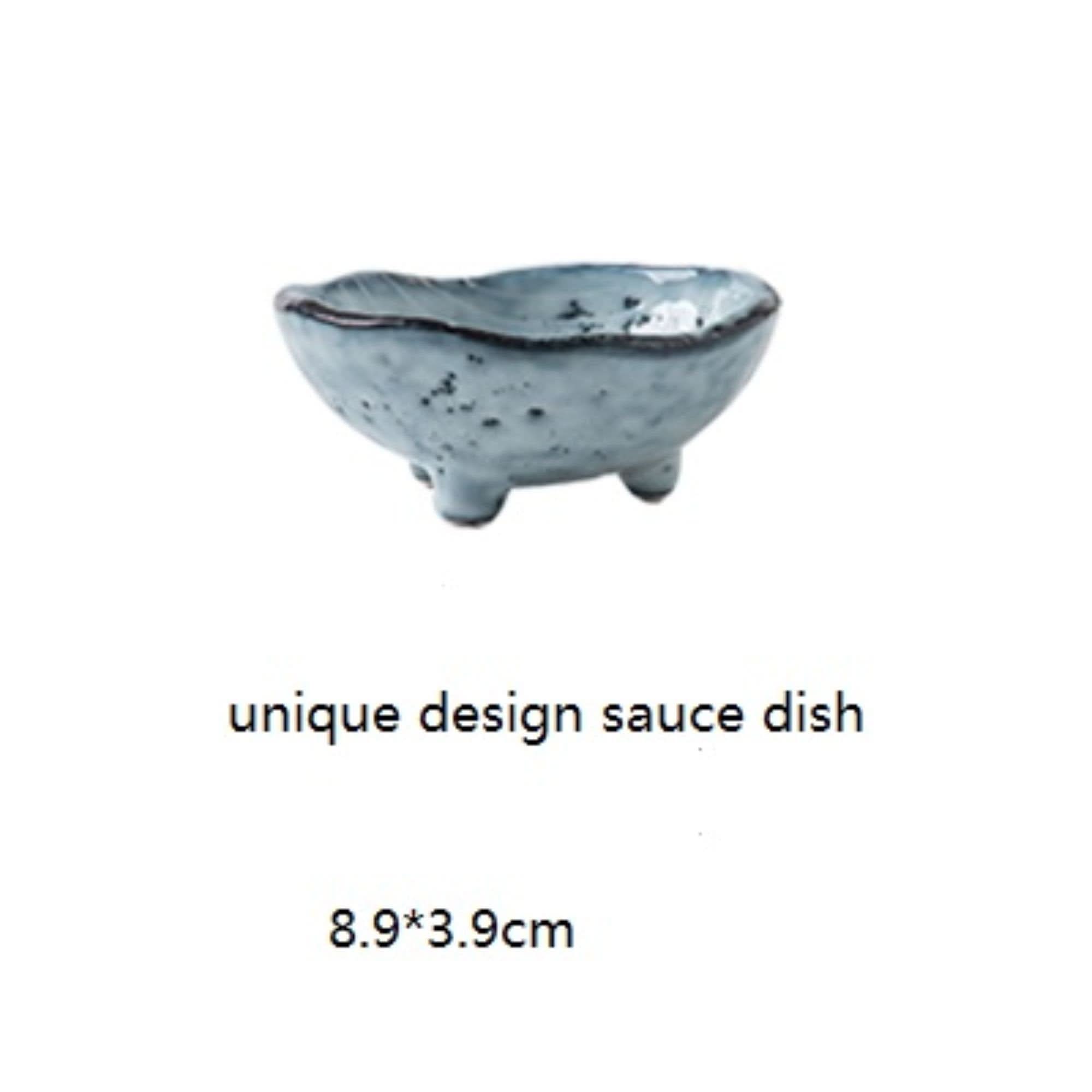 Light blue speckled ceramic sauce dish from Japanese tableware set, unique design.