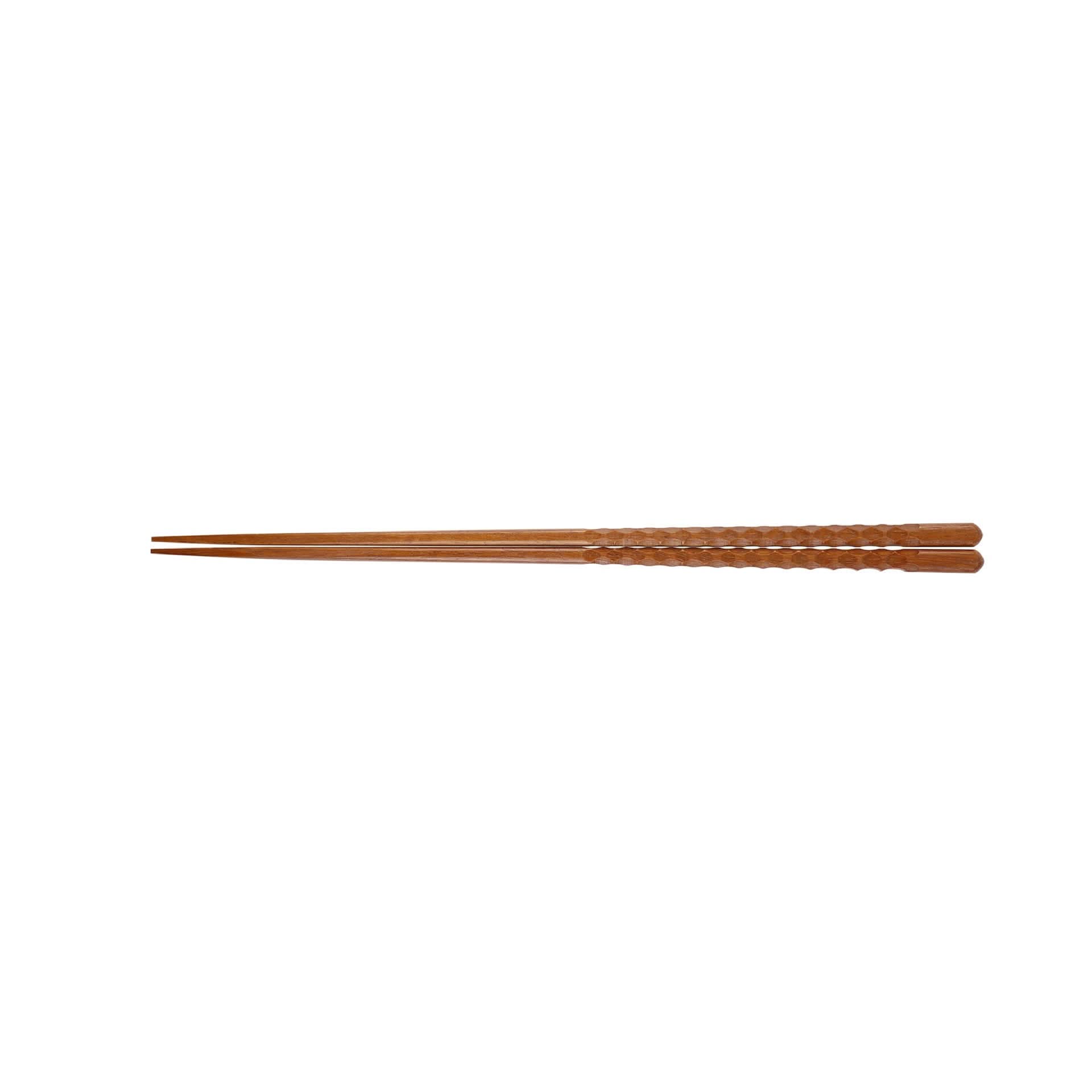 Natural wooden Japanese chopsticks with carved designs, a spoon, and chopstick rest.