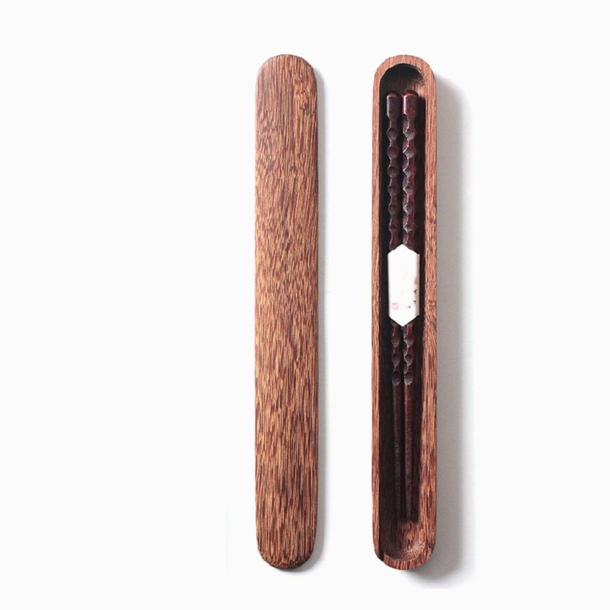 Natural wooden Japanese chopsticks with case and spoon, featuring carved detail.