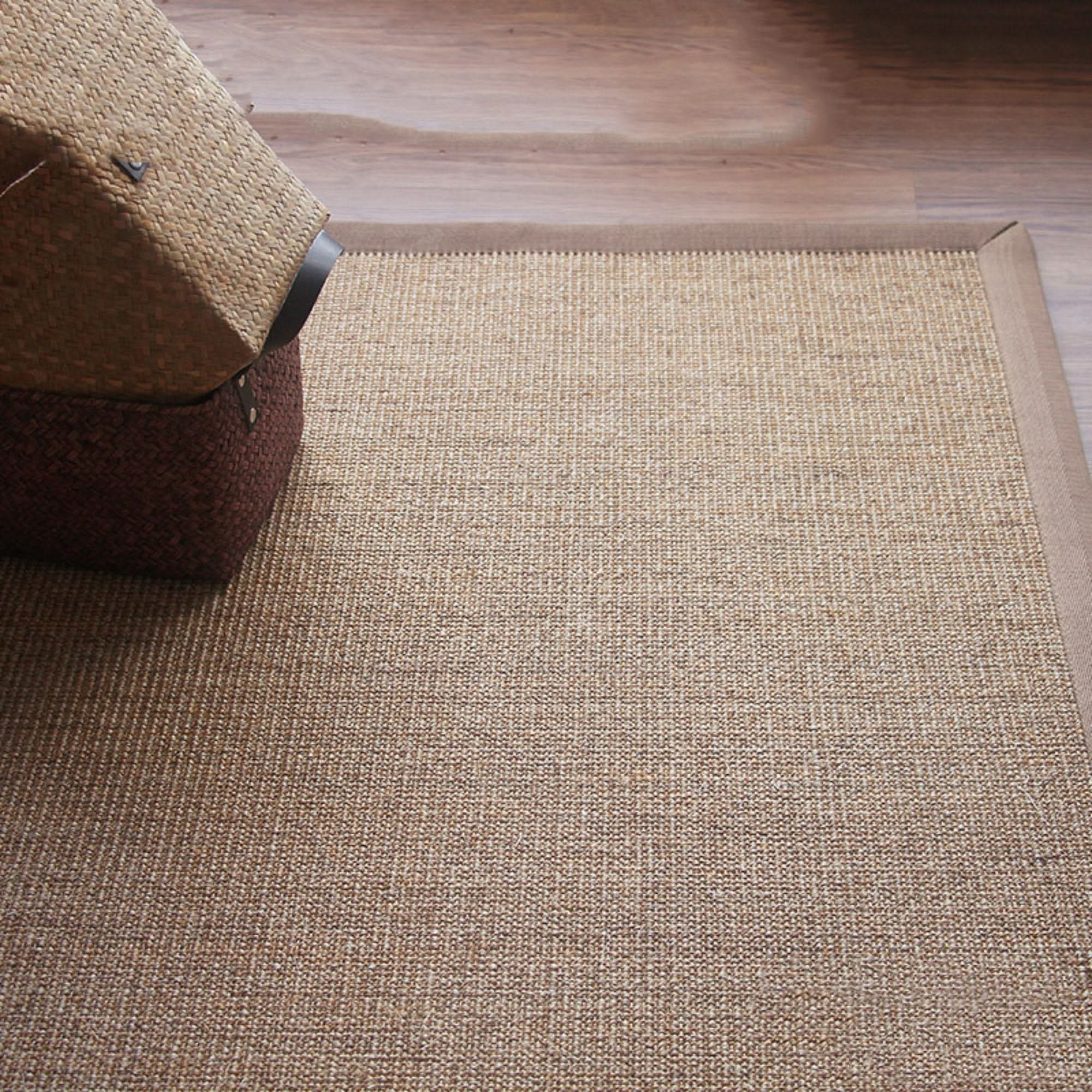 Natural fiber Jug Rug With Covered Borders, braided & rustic design on hardwood floor.