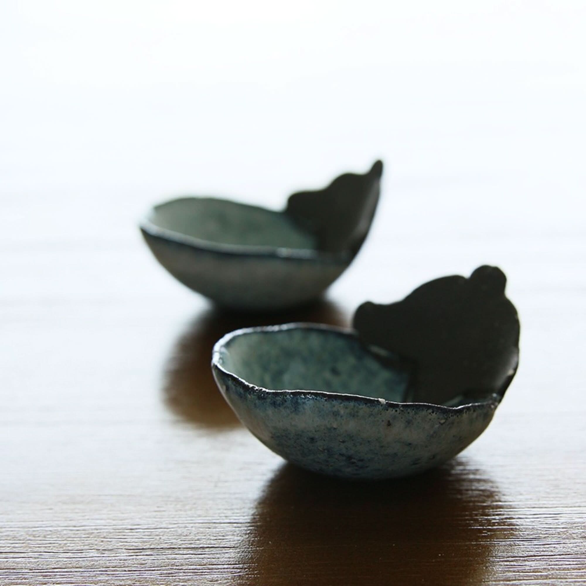 Mino-yaki handmade vegetable shape dip bowls, blue stoneware, on wood surface.