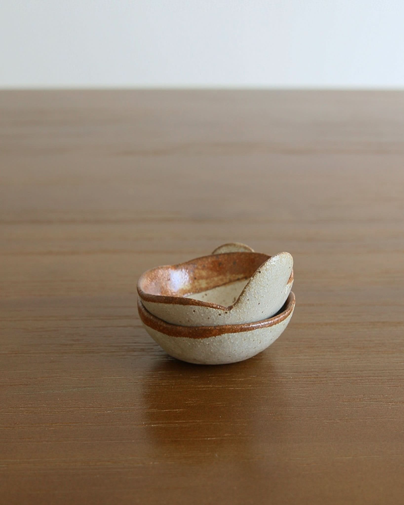 Mino-yaki handmade stoneware vegetable-shaped dip bowls on wooden surface.