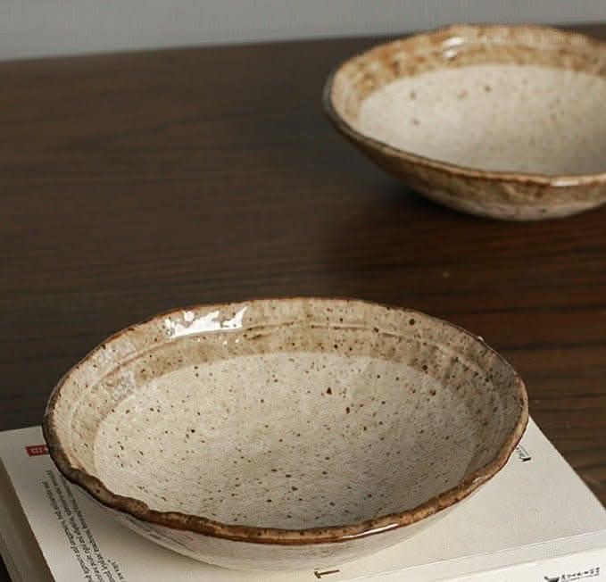 Minoyaki Irregular Ceramic Soup Bowl in beige and brown hues on a wooden table.