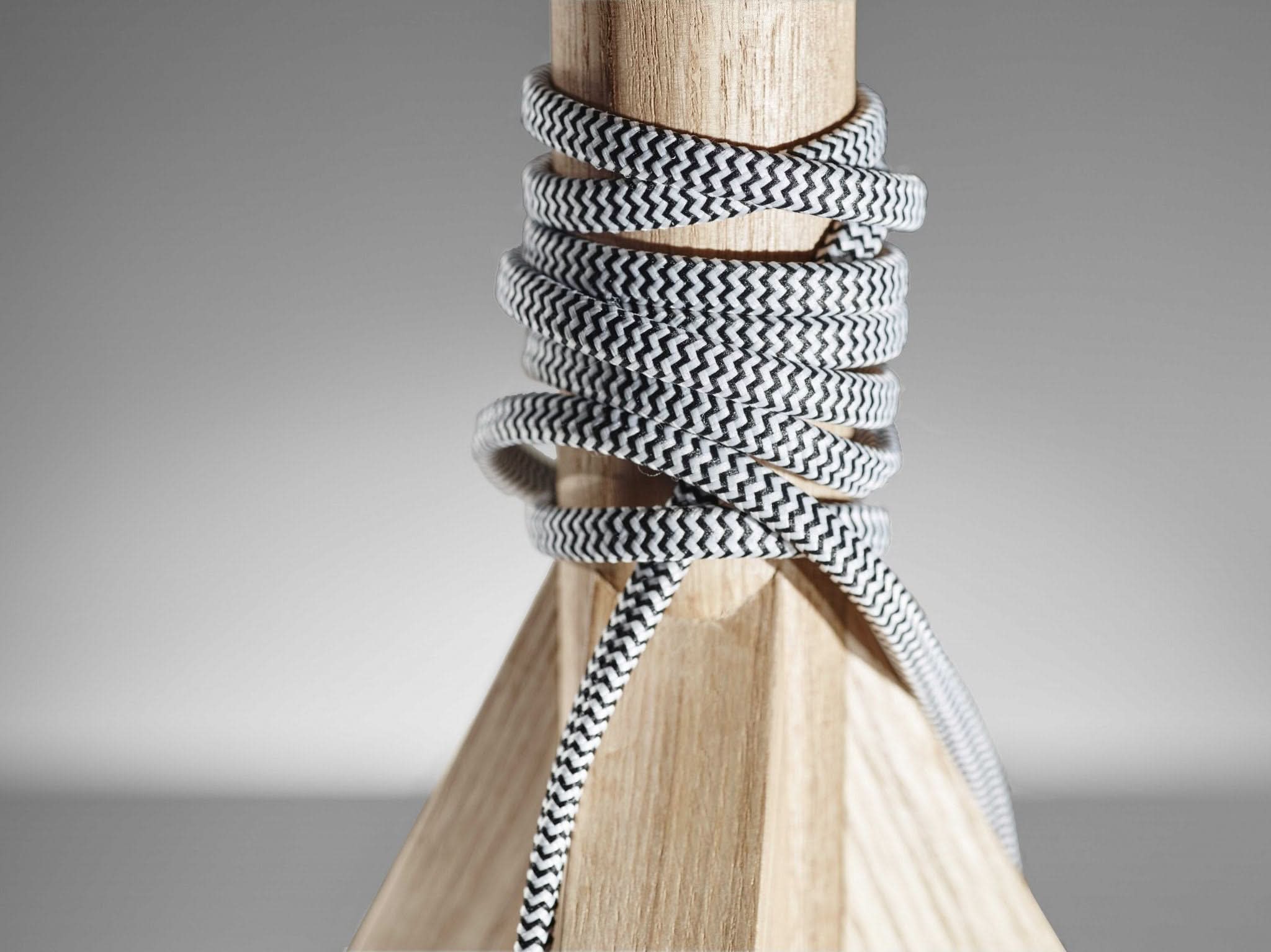 Natural wood tripod base table lamp with chevron cord detail