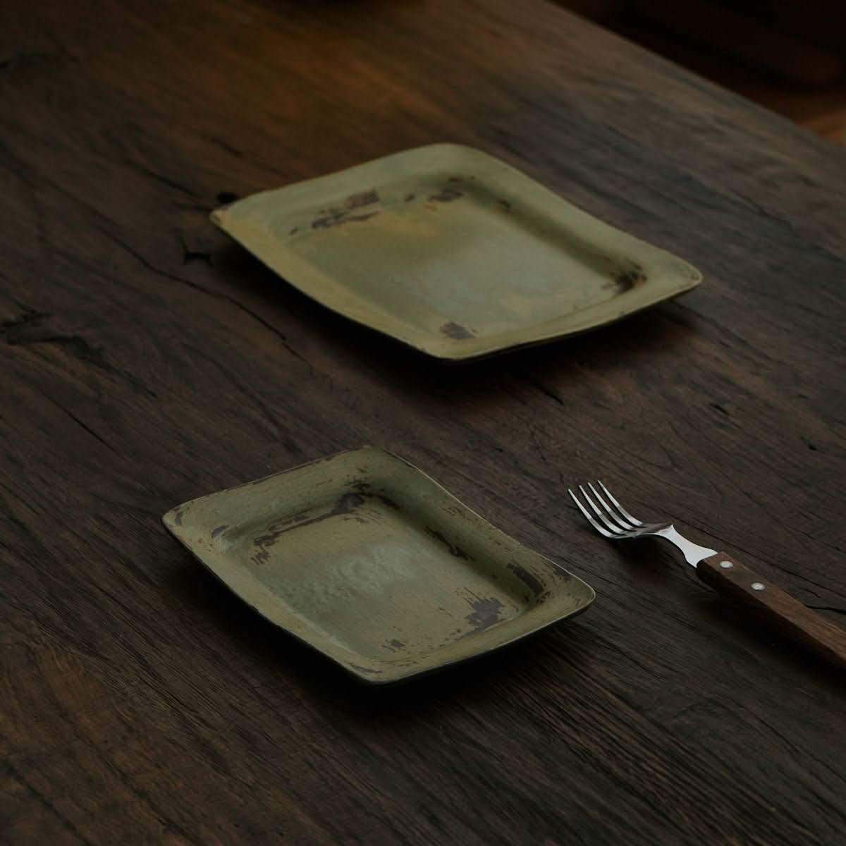 Wabi sabi Japanese-style brushed pottery oval dinner plate with rough texture.