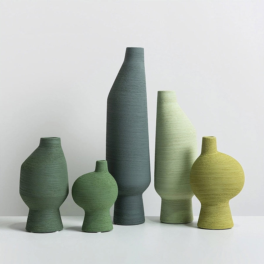 Nordic abstract vases with rough texture in green and grey tones, ceramic, minimalist zen decor.