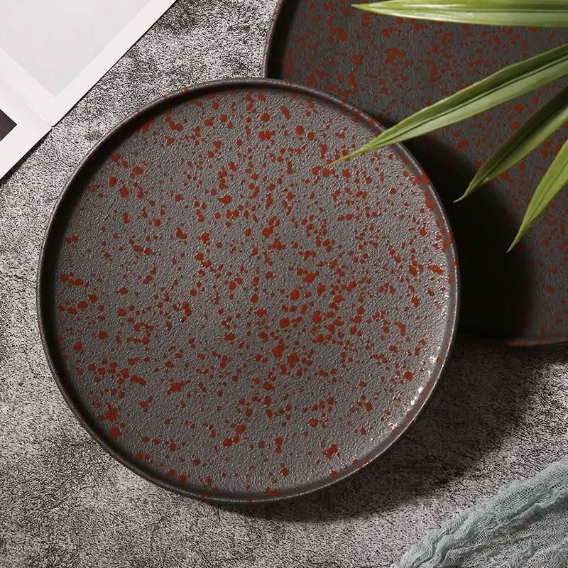 Oxid Metal Look Ceramic Plates: rustic, Japanese round matte plates with a speckled red glaze.