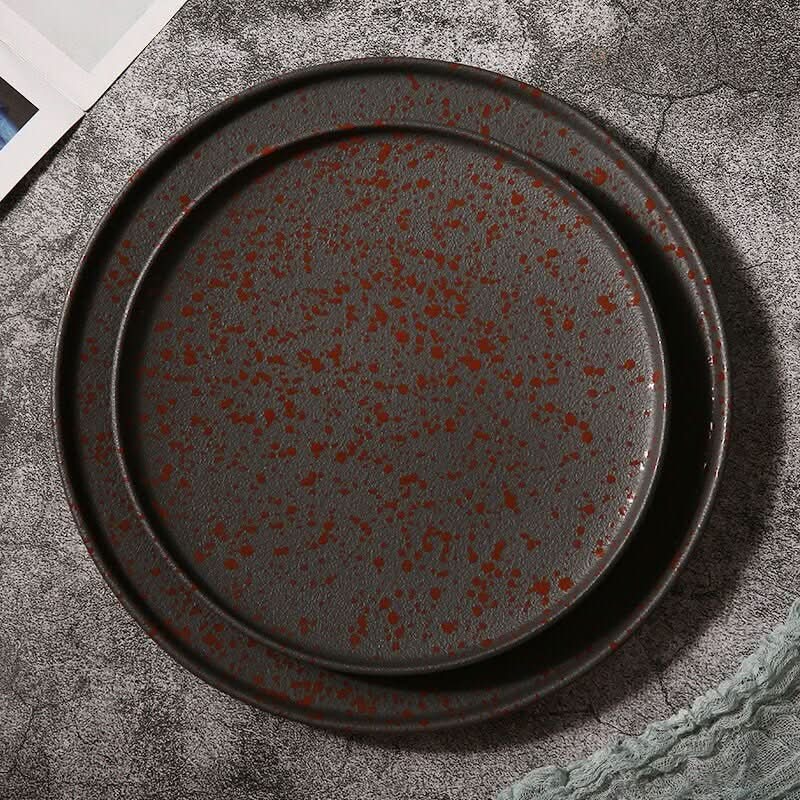 Oxid Metal Look Ceramic Plates: rustic glazed, round ceramic with matte finish and red speckles
