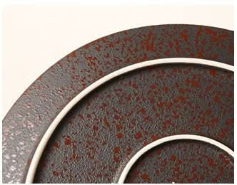 Oxid Metal Look Ceramic Plates: Rustic matte glaze with reddish speckles and white rim.