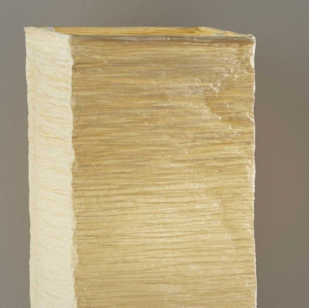 Paper shade table lamp with natural wood accents, warm textured finish.