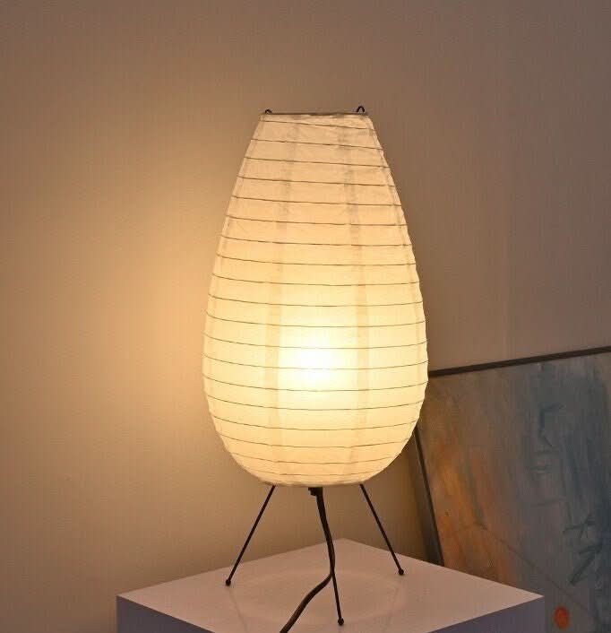 Paper Table Lamp Long Oval Lamp, mid-century Asian style, bedside light, on white surface.