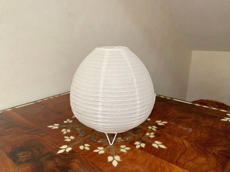White paper table lamp on a decorative wooden table, home decor accent