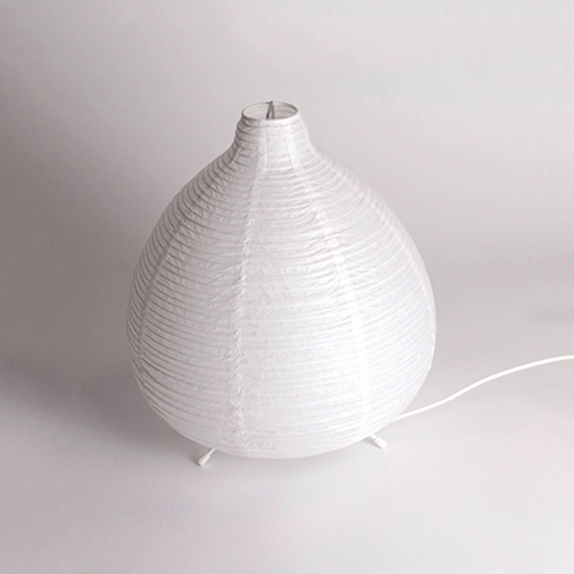 White paper table lamp with tear shape, mid century desk or bedside light.