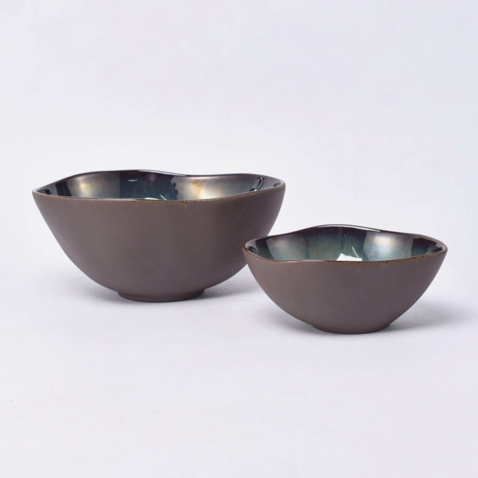 Gray matt stoneware pasta bowls with a subtle iridescent glaze interior.