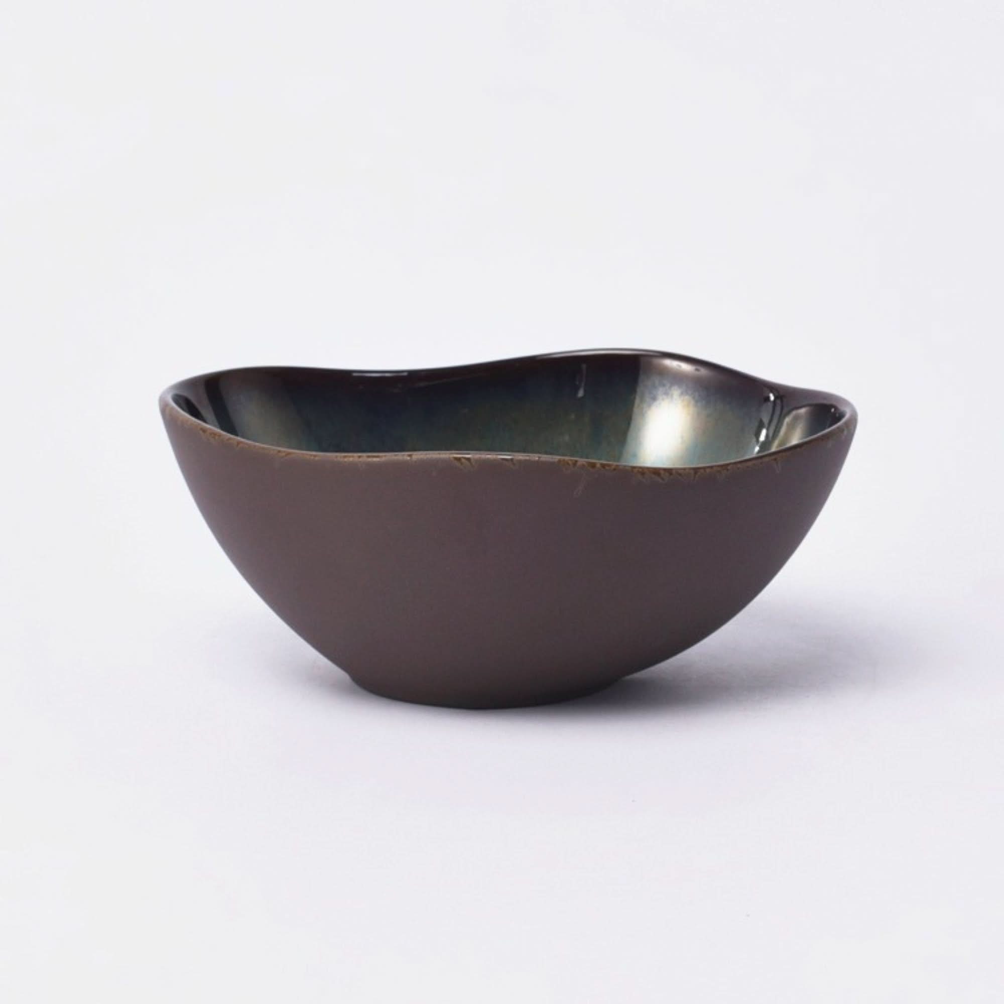 Gray matt stoneware pasta bowl with a glossy interior on a white background.