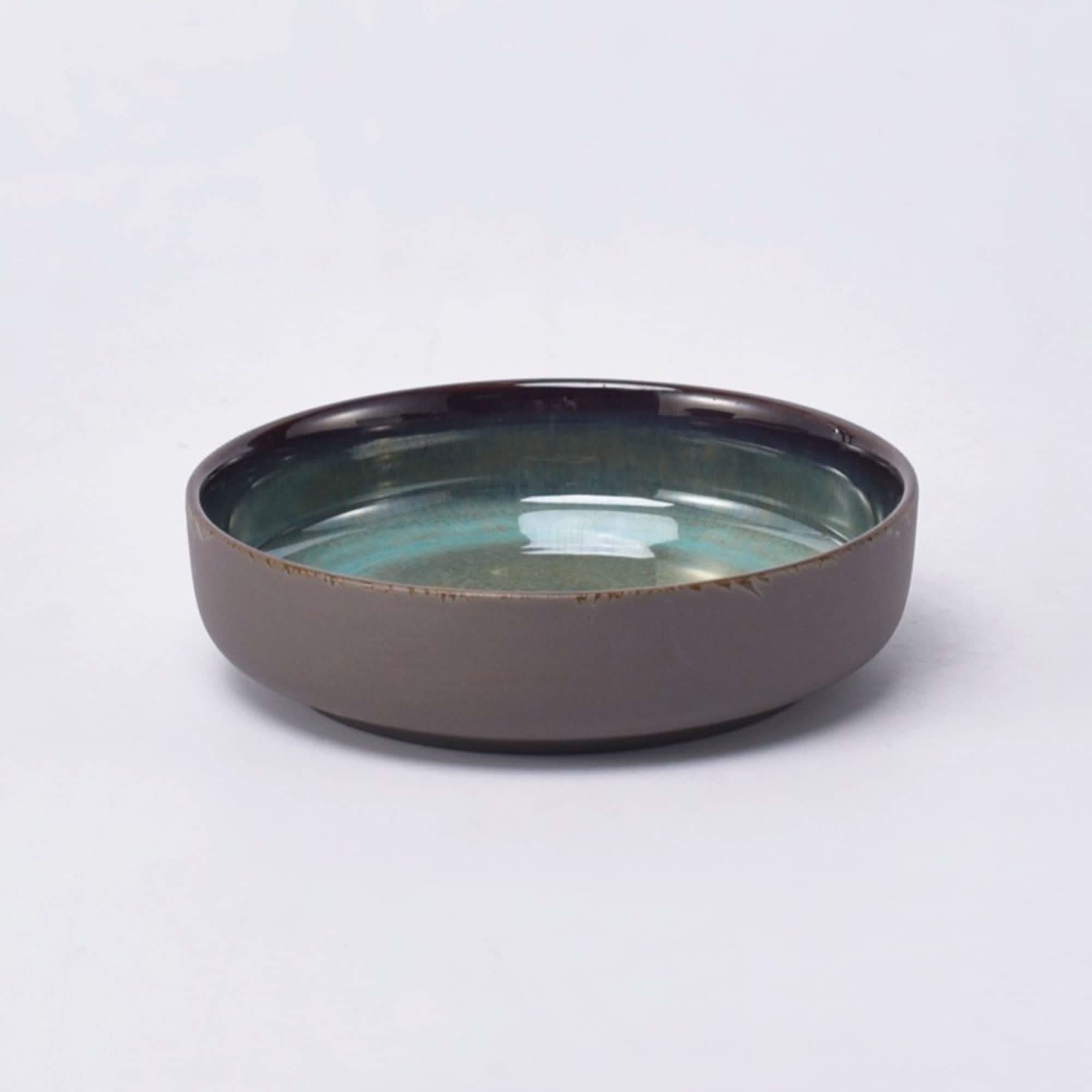 Rustic gray matt stoneware pasta bowl with a turquoise glazed interior.