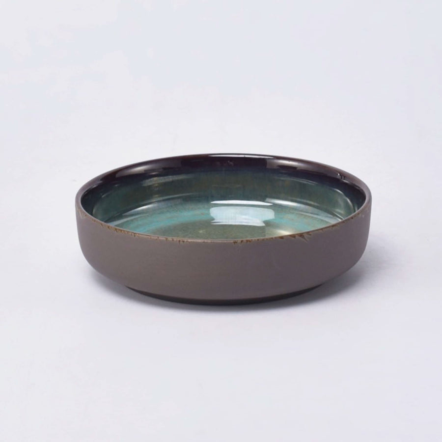 Rustic gray matt stoneware pasta bowl with a turquoise glazed interior.