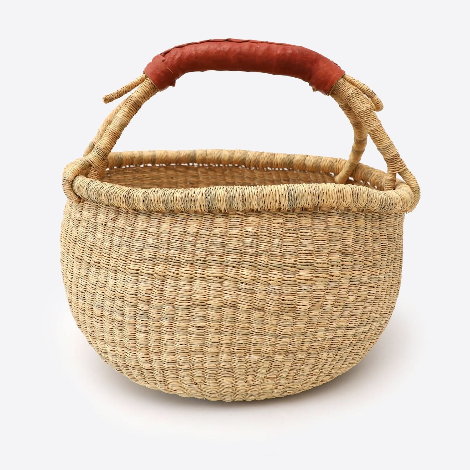 Natural raffia wool woven storage basket with brown leather handle. Home decor laundry hamper.