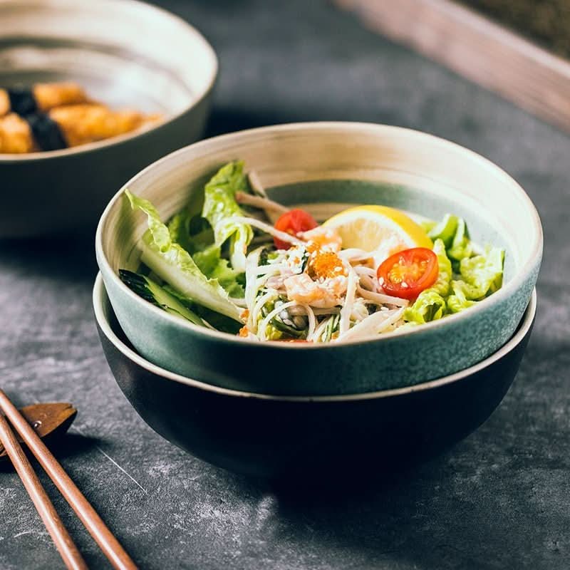 Matte 30.4oz Ramen Bowl with two tones and a fresh salad, on a textured surface.