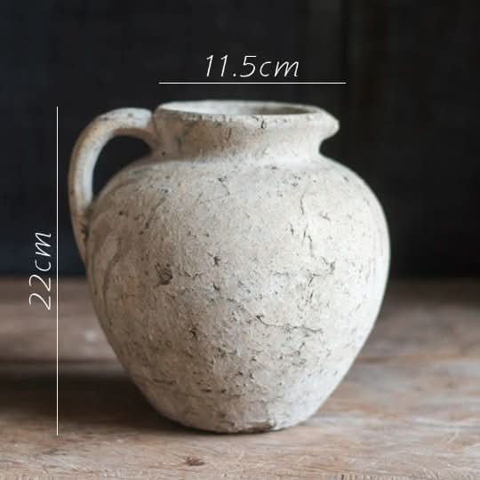 Rustic off-white clay pot with ears, home decor accent.