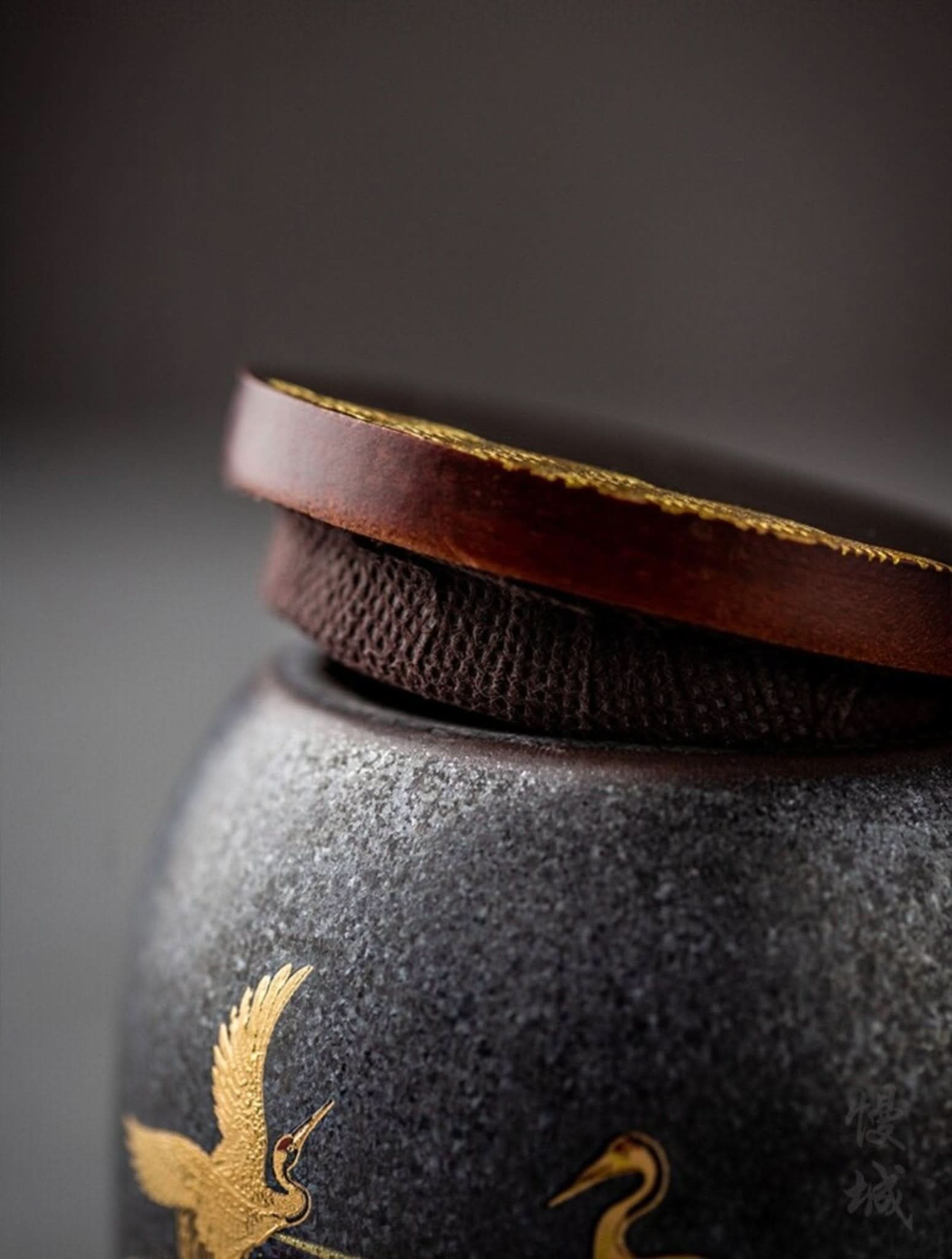 Retro Black Ceramic Tea Canister with gold crane detail and wooden lid.