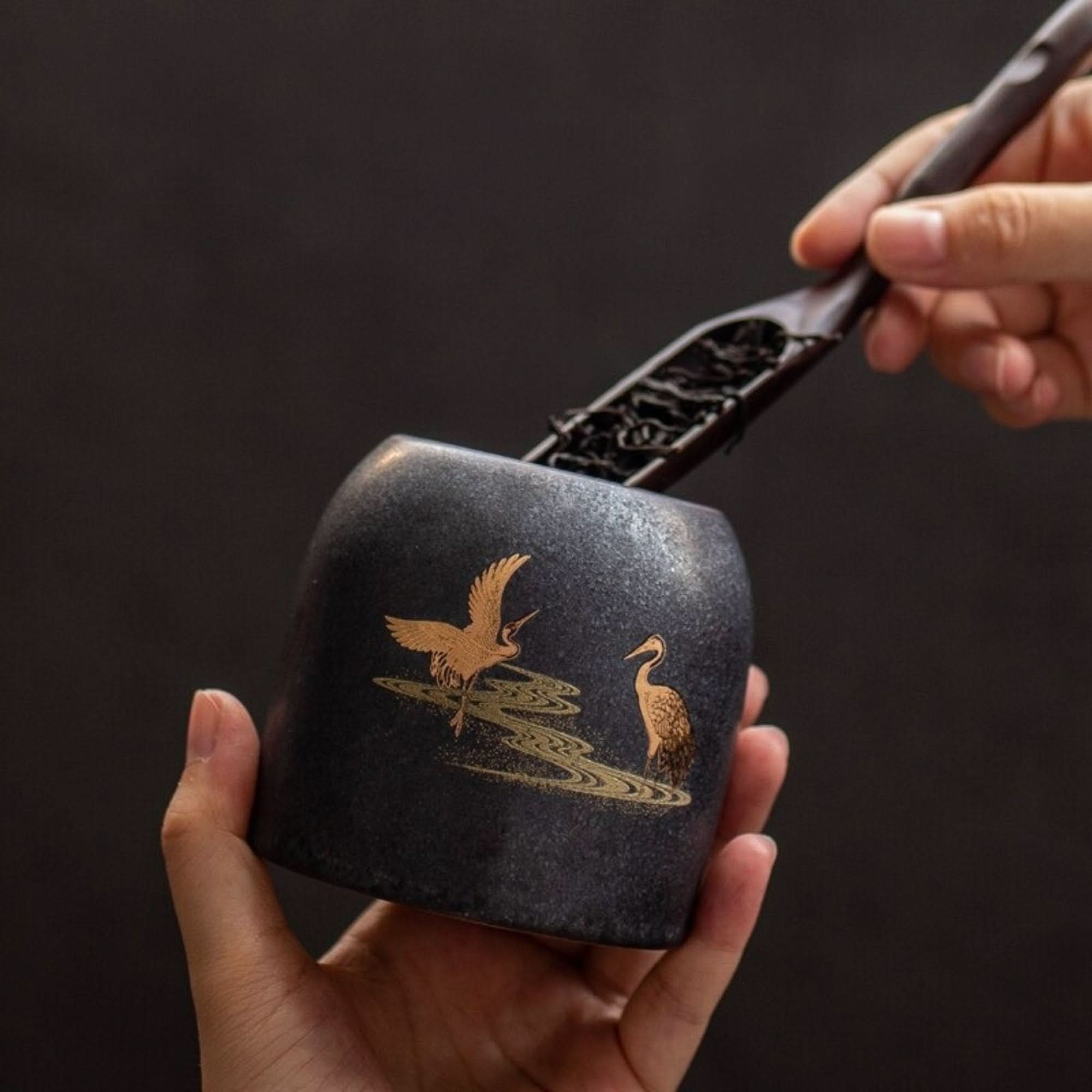 Retro black ceramic tea canister with gold cranes. Home decor.