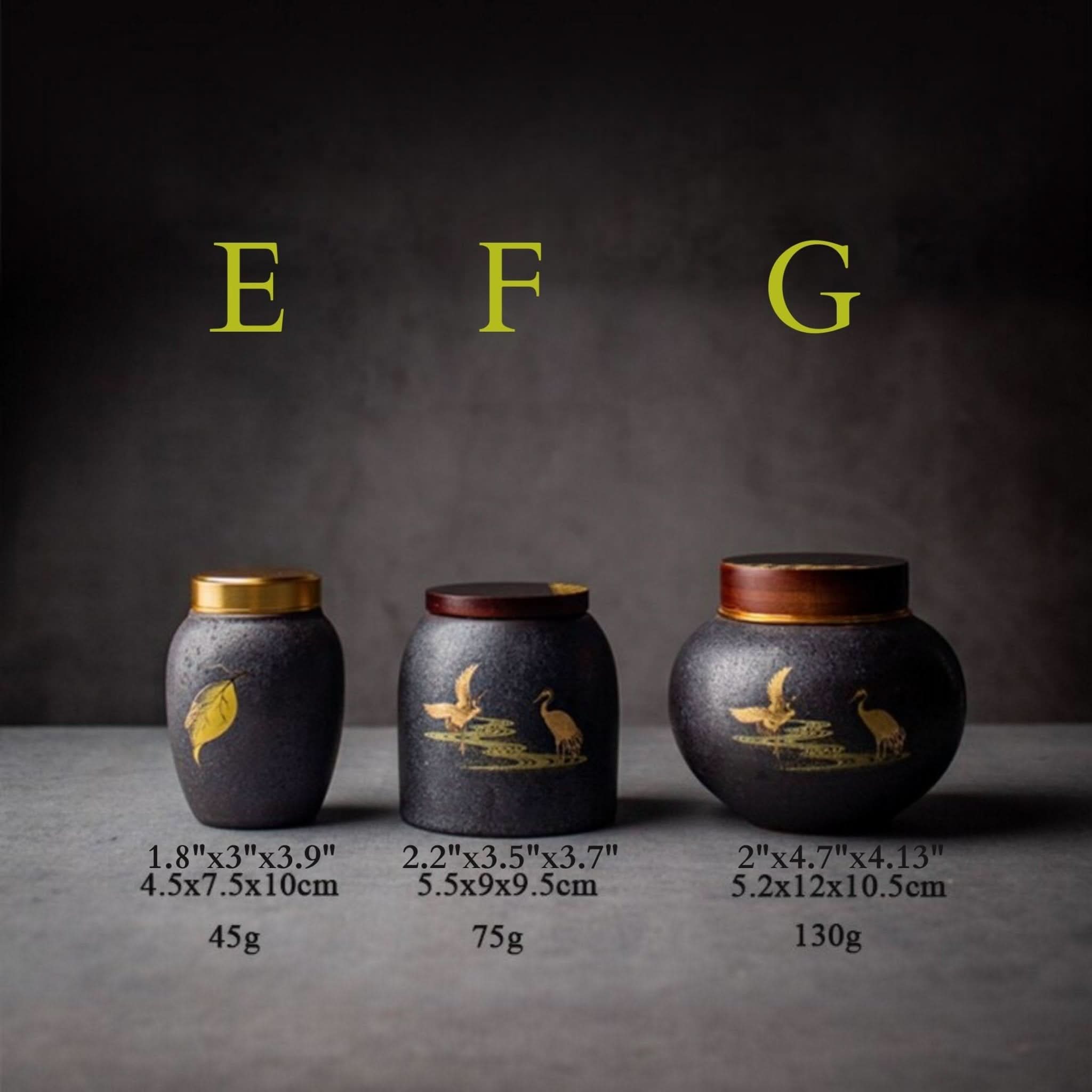 Retro black ceramic tea canister with gold leaf or crane designs. Home decor.