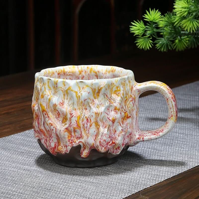 Retro Handmade Stoneware Coffee Cup, colourful reactive glaze paint-drop pottery, textured.
