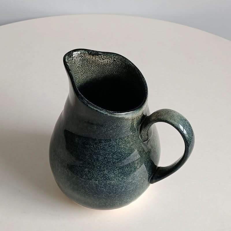 Retro Kiln-Changing Glaze Ceramic Milk Tank, deep blue speckled glaze, on white surface