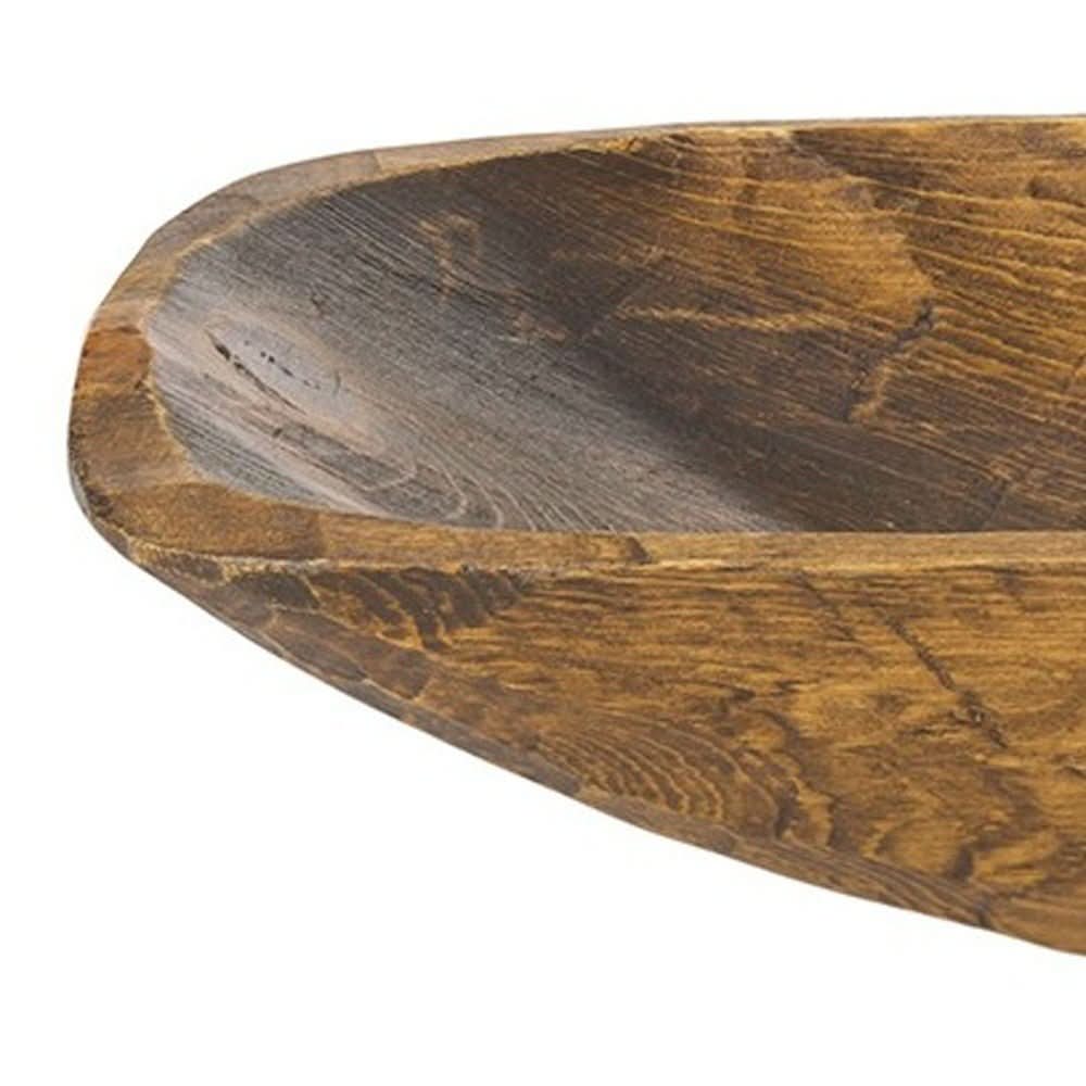 Rustic brown and natural handcarved thin oval centerpiece bowl, showcasing textured wood grain.